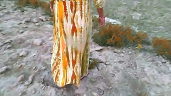 Indian Village Housewife And Husband Captured Outdoors